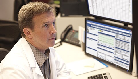 A doctor analyzing telehealth data