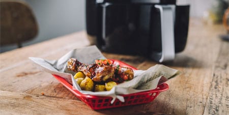 Pittige Kip met tomatensalsa en kerriekrieltjes 