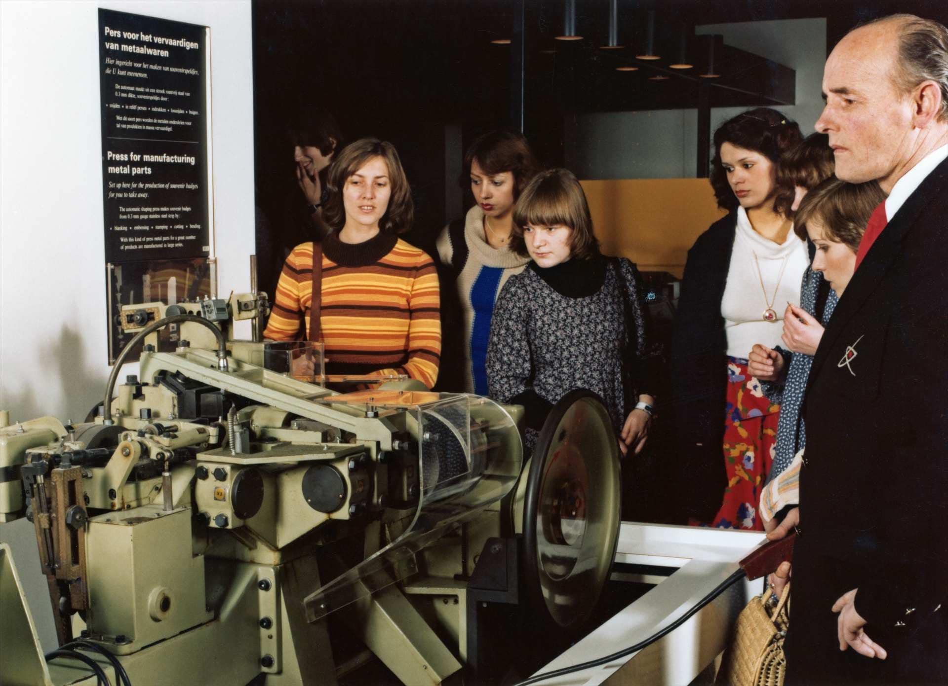 Explanation on metal press, ca 1981.